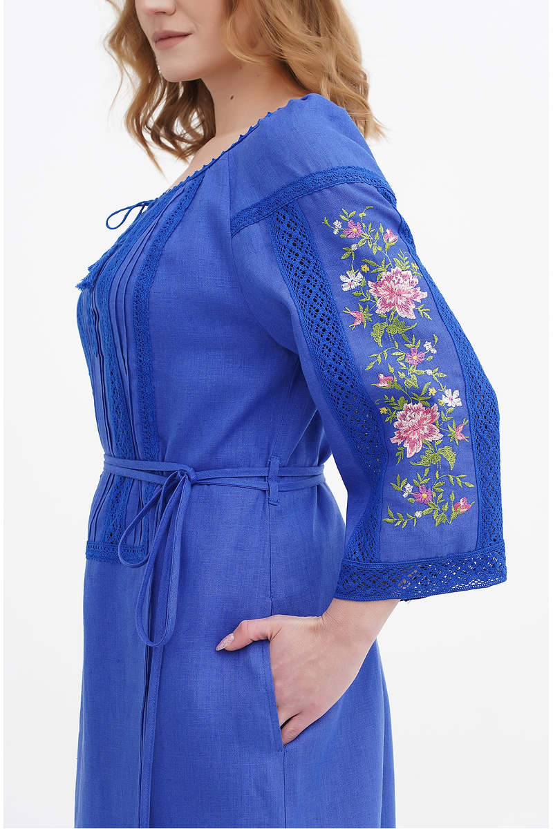 Blue dress embroidered with Orzhitsa.